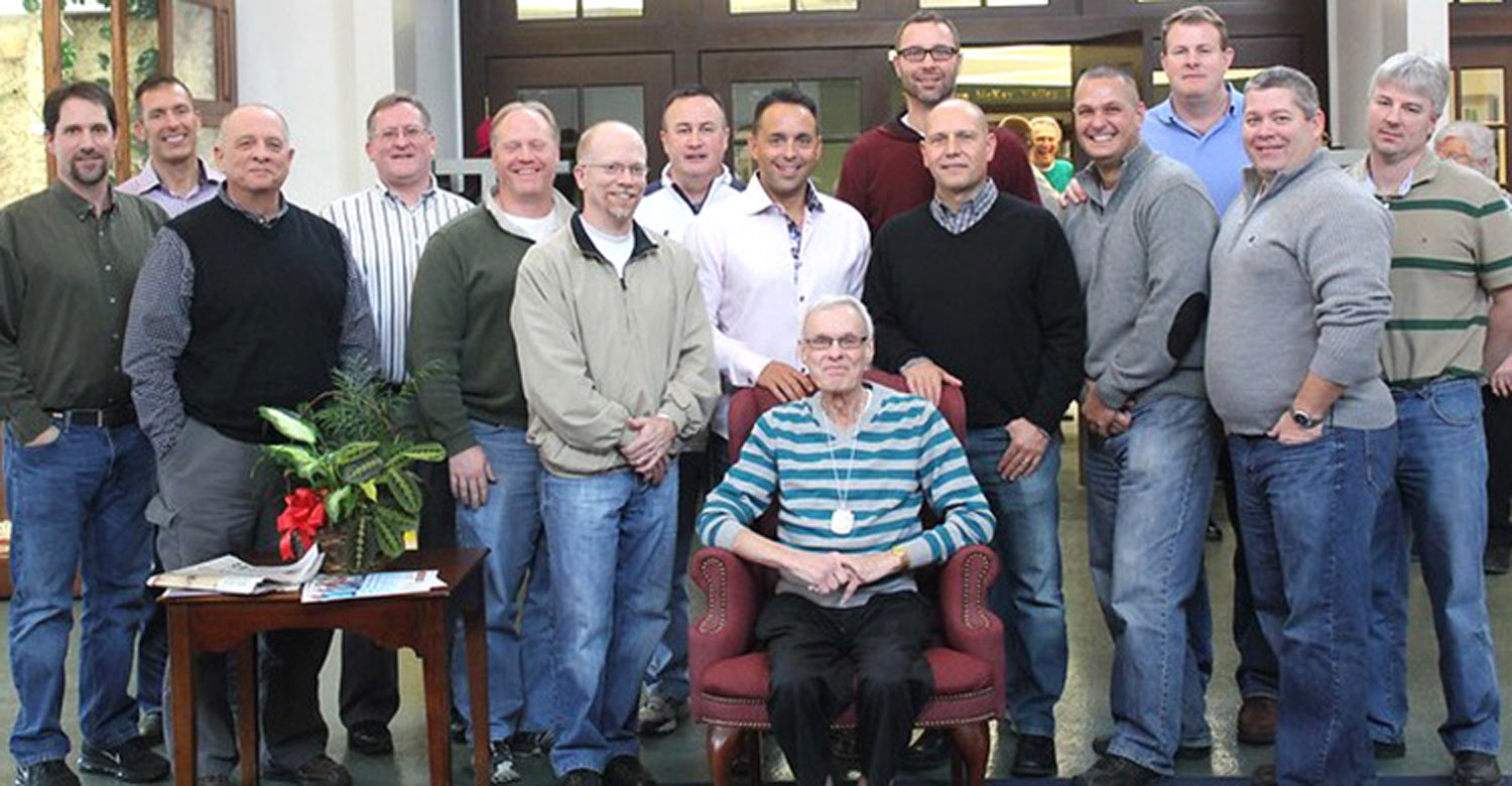 the late Dave Friermood (seated) takes a large group photo with his "boys"